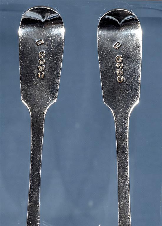 A pair of William IV silver fiddle pattern serving spoons and a similar Victorian pair, Length 237mm, weight 4.9oz/153grms